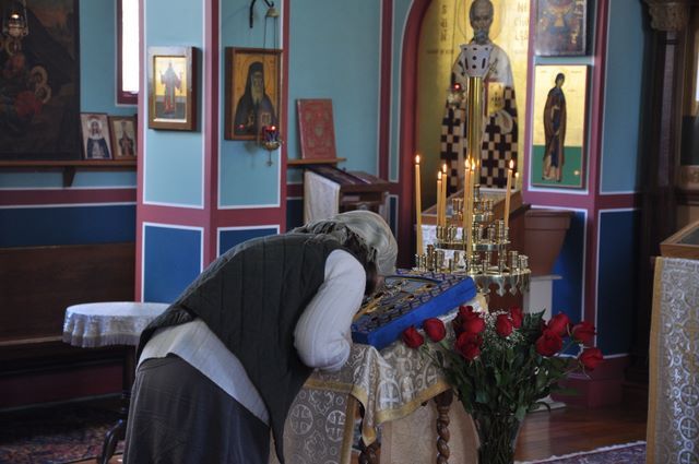 A parishioner venerates the Kursk Root icon