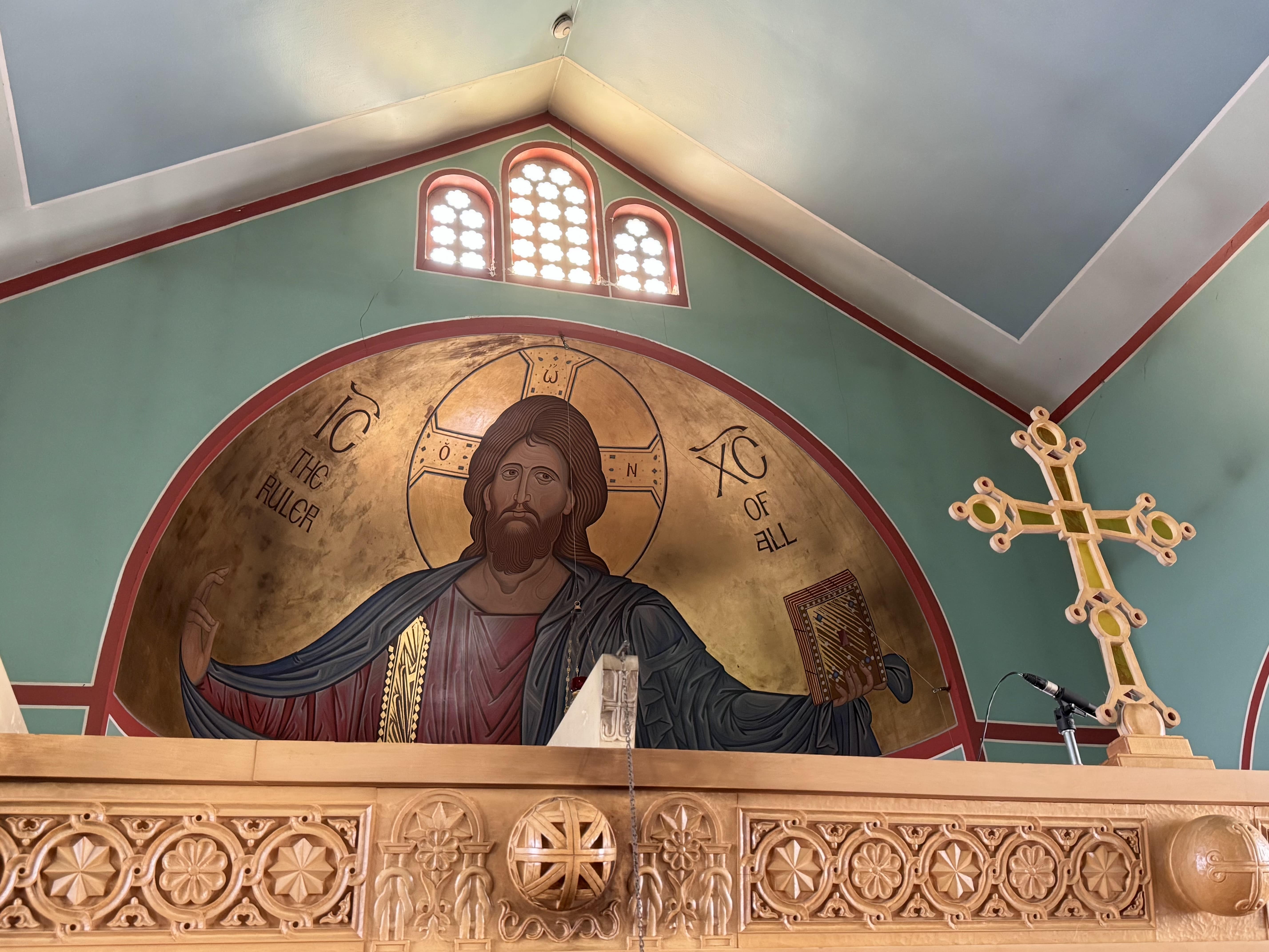 Looking up past the iconostasis to the icon of the Lord Jesus Christ above the altar.
