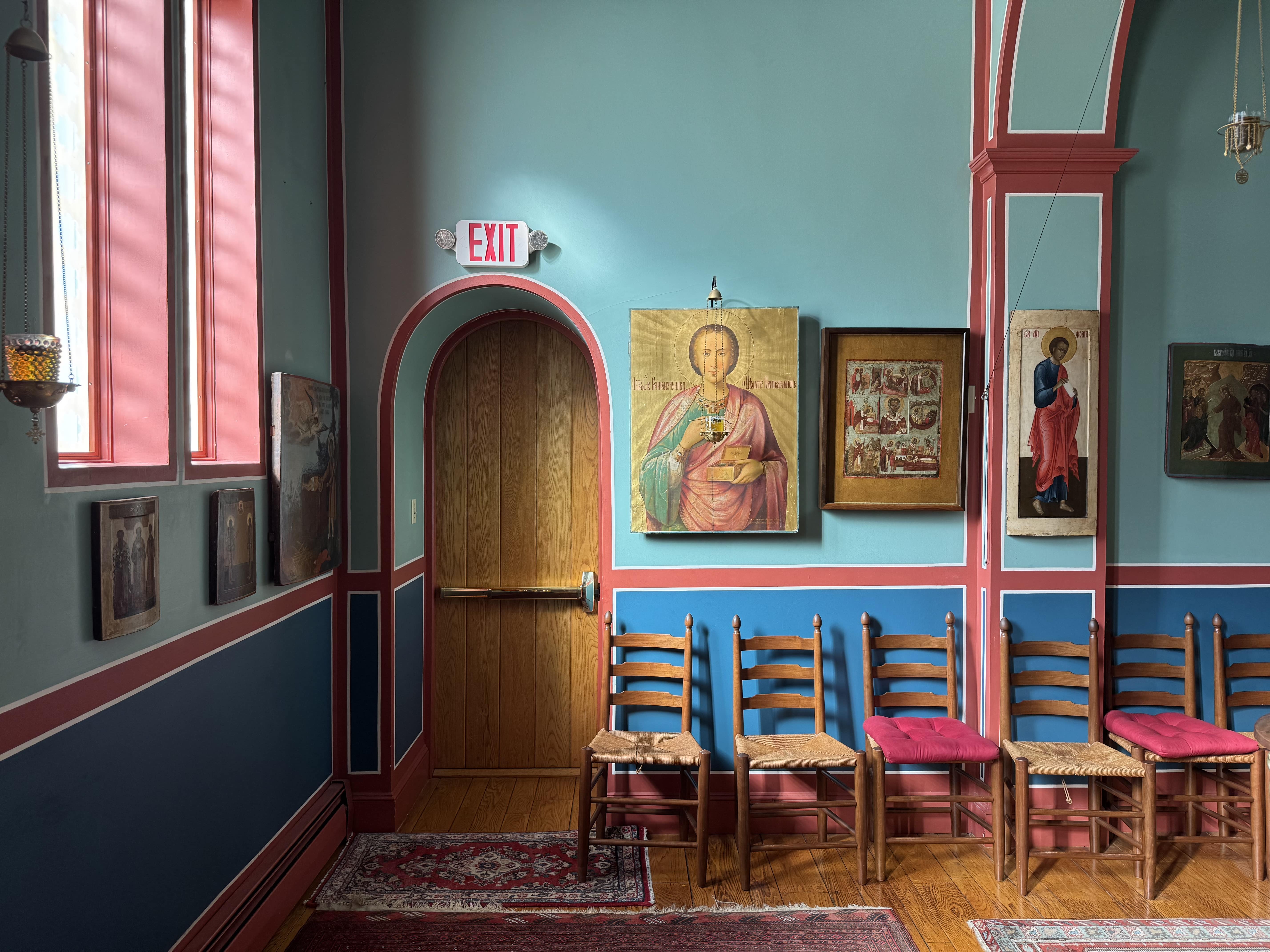 Facing the back of the church towards icons and the door to the kid's room.