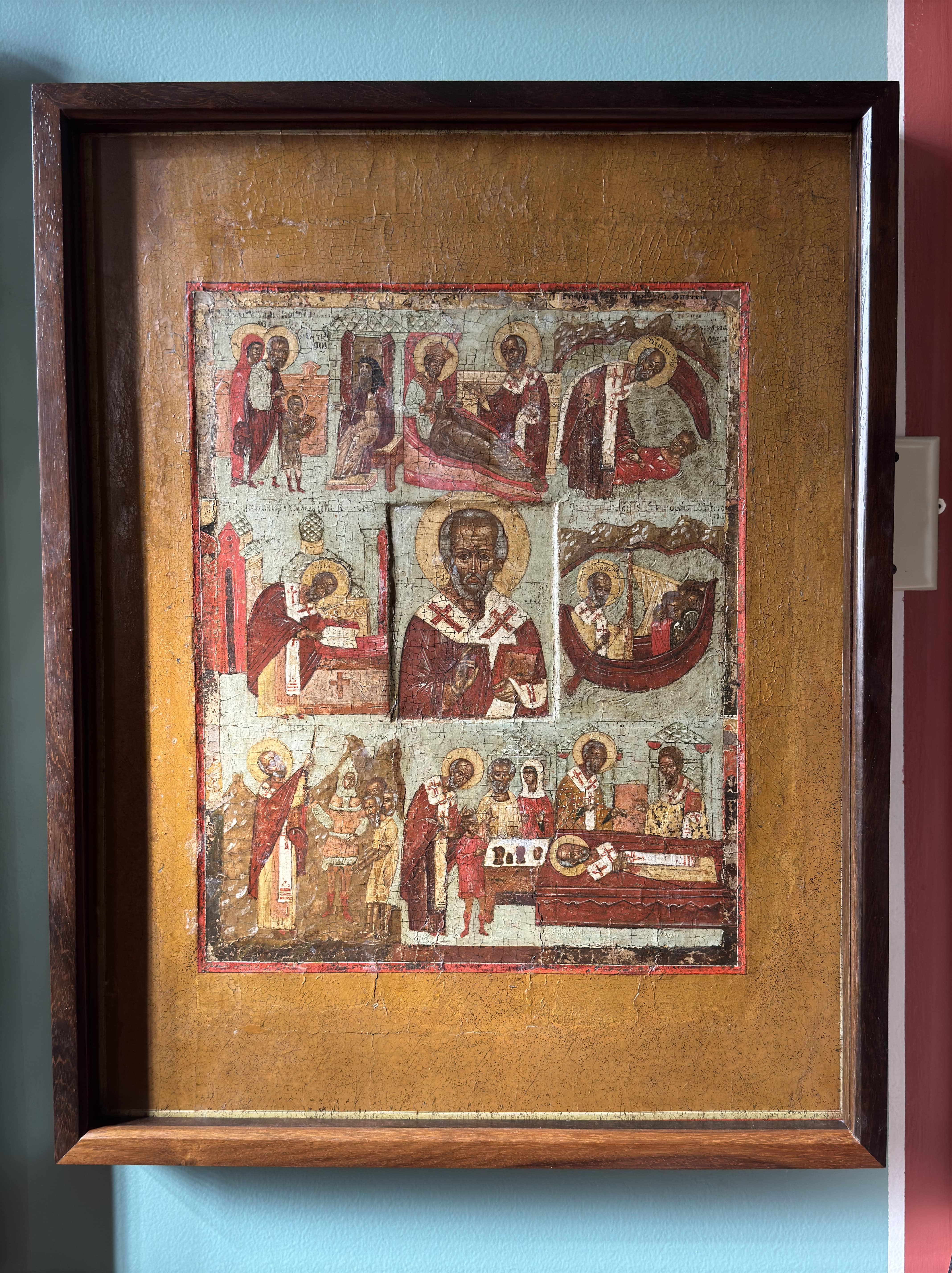 A centuries-old icon depicting the life of St. Nicholas, including interceding after his repose.