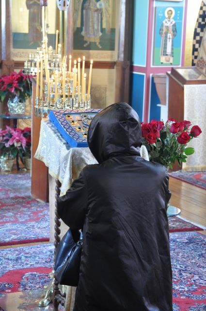 A parishioner prostrates before the Kursk Root icon