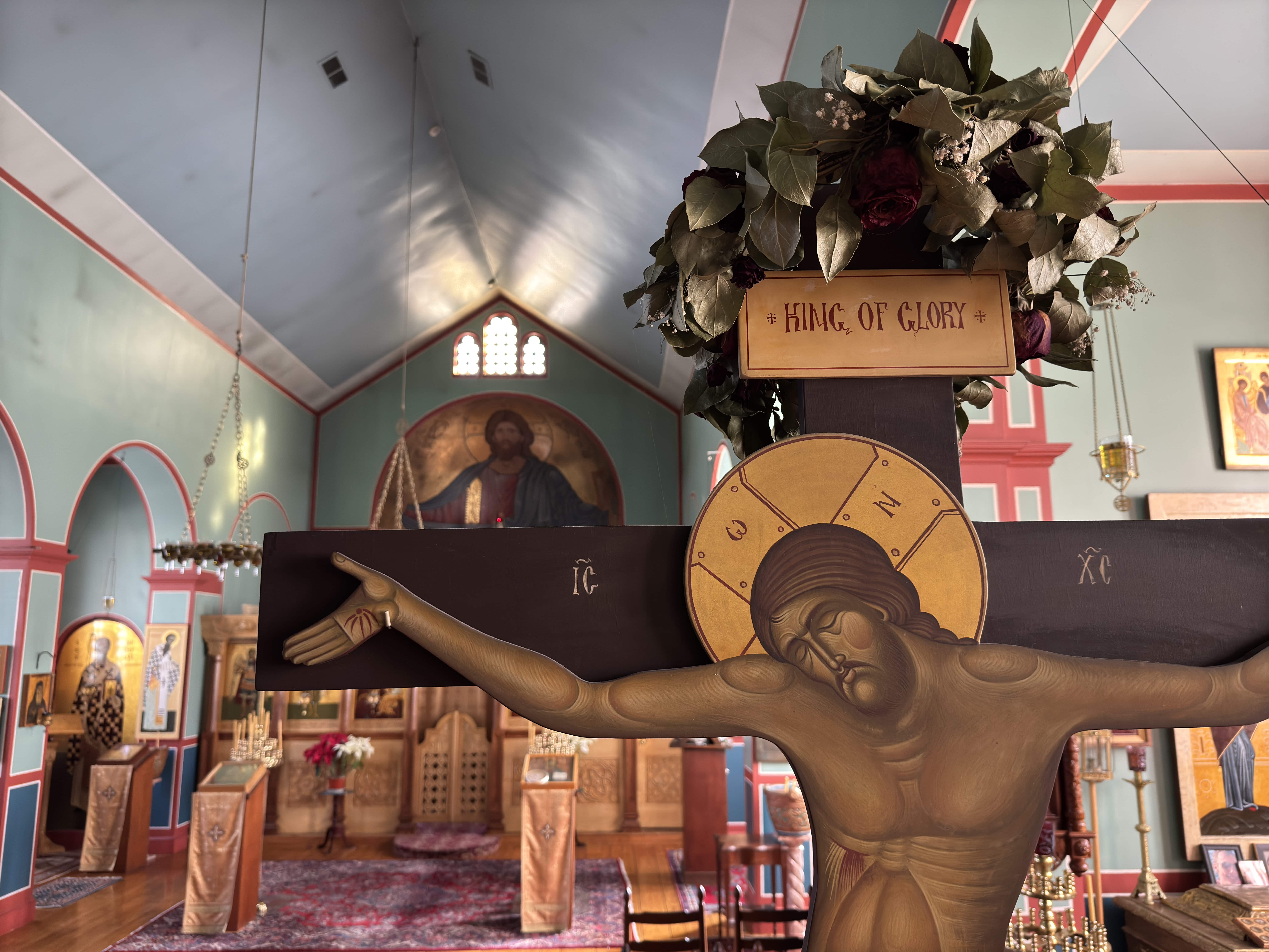 An icon of Christ on the Cross near the back of the narthex