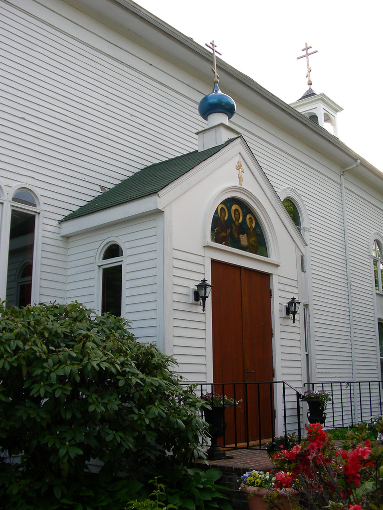 Front doors of the church on a cloudy day in summer