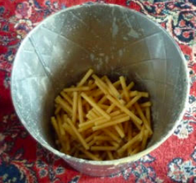 Bin of used beeswax candles at St. John the Russian Orthodox Church