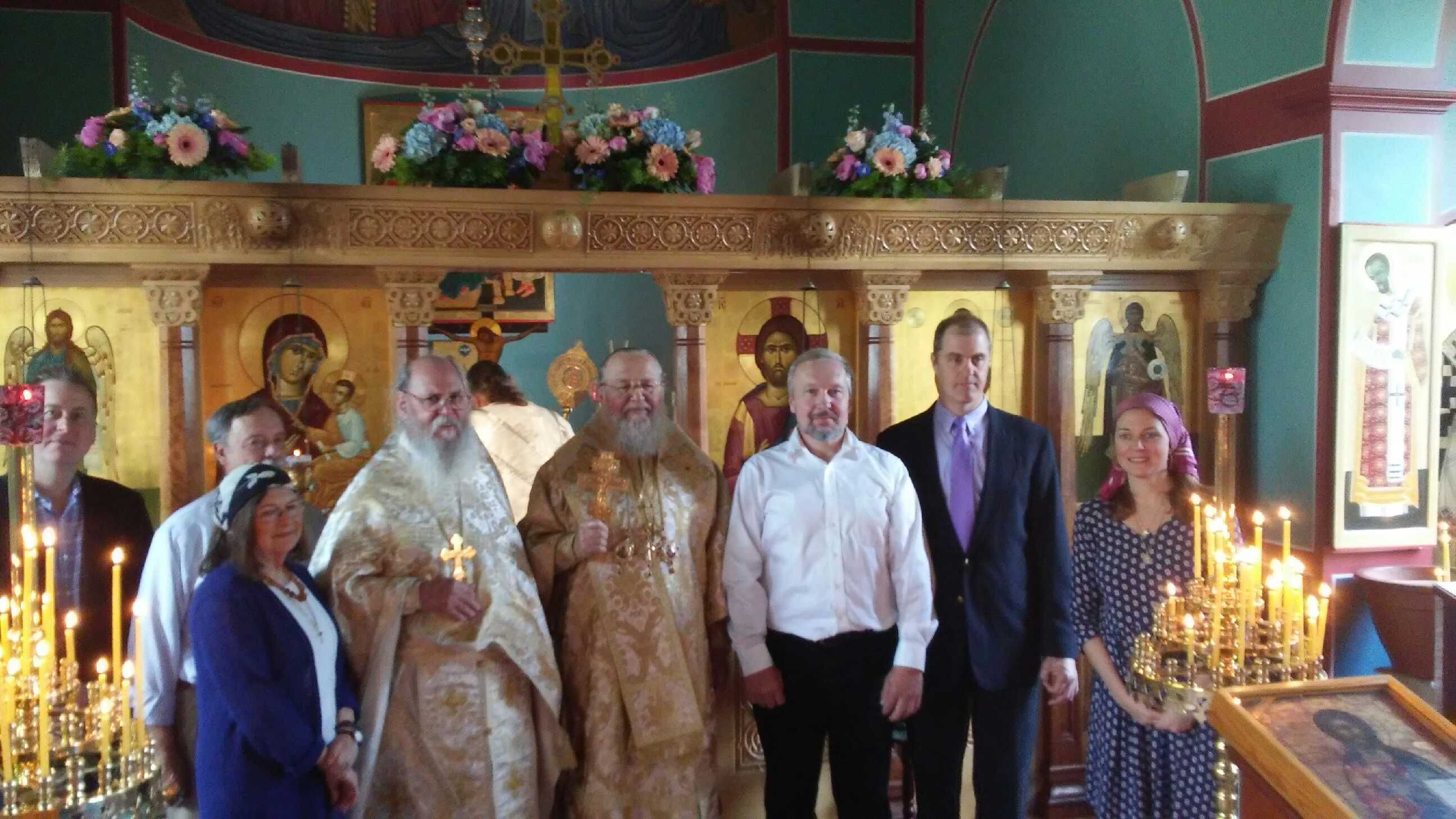 Clergy and laity standing in front of iconostasis during Met. Hilarion visit